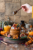 Pumpkin pancakes with autumn fruits