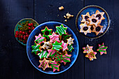 Star-shaped Christmas cookies, some frosted some jam filled