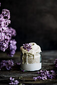 Banana dessert with yoghurt-amaranth and lilac blossoms