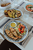 Grilled fish with salad and dressing