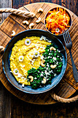 Creamy polenta with cashew spinach and carrot-apple salad