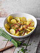 Potato salad with bacon, onions, and chives
