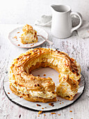 Choux pastry wreath with apple cream and almonds