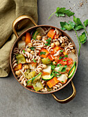 Stew with whole wheat noodles, chickpeas, celery and zucchini