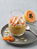 Vegan Overnight Chia Oats with papaya and coconut chips