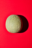 Cantaloupe melon on a red background