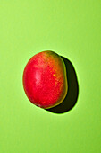 Mango on a green background