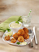 Meatballs in crispy noodle coating with dipping sauce