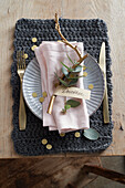 Christmas place setting with eucalyptus branch