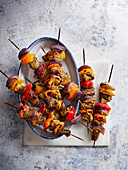 Spicy beef skewers with peppers and onions