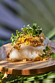 Cod with a crumb crust and sprouts