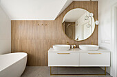 White bathroom with imitation bamboo wall tiles on top floor