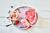 Swirled strawberry yogurt ice cream and strawberry ice cream balls