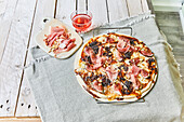 Pizza with ham and figs
