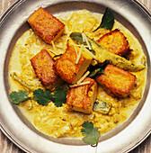 Chickpea dumplings in yogurt curry sauce (Rajasthan, India)