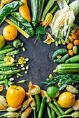 Green and yellow vegetables creating a picture border with copy space