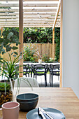 View from the dining area to the terrace with table and chairs