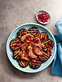 Grilled eggplant with pomegranate seeds and pork