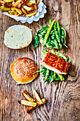 Sandwich of salmon, spinach and green asparagus with fries