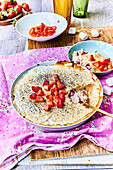 Rice pudding with strawberries and poppy seeds
