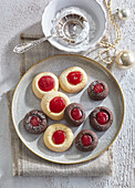 Chocolate and vanilla thumbprints with raspberry jam