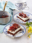 Cocoa cake slices with caramelised plums