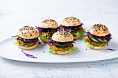 Vegan mini burgers with red cabbage and cucmbers