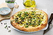 Spring pizza with sprouts