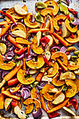 Roasted vegetables with butternut squash, peppers, carrots, potatoes, and red onions