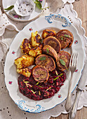 Roasted goose with beet and potato pancakes