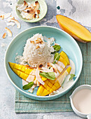 Sticky rice with mango and coconut chips