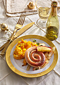 Baked sausage snail with apple and pumpkin puree