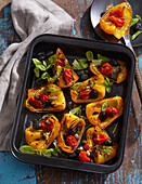 Grilled peppers with tomatoes and olives