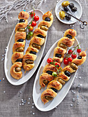 Skewered garlic bread sticks with olives