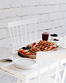 Waffles with fresh berries, berry juice