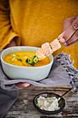 Curry soup with salmon skewer