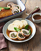 Stuffed turkey roll with smoked meat and spinach