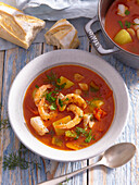 Tomato soup with prawns and codfish