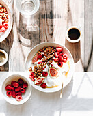 Yogurt bowl with granola, figs, raspberries and honey