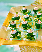 Mini round zucchini with fish cream and salmon caviar