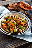 Autumn vegetable dish with brussels sprouts, pumpkin and beans