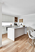 Modern, white kitchen, and dining area in coastal style