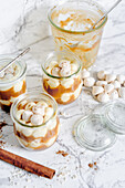 Layered dessert with apple sauce and meringue