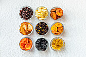 Dried fruit in nine jars