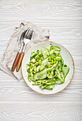 Vegan green salad with avocado, cucumber and edamame