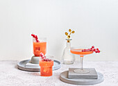Grapefruit and gin cocktails with sugared red currants