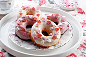Donuts with heart-shaped sugar sprinkles
