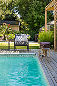 Pool with wooden surround in the garden