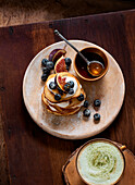 Pancakes with blueberries, figs and maple syrup