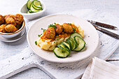 Vegan lentil ragout with mashed potatoes and vegetable meatballs